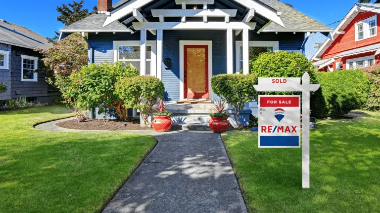 A sold sign outside a house, from the original closing guide.