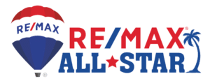 logo for the remax real estate team for buying a house in pinellas